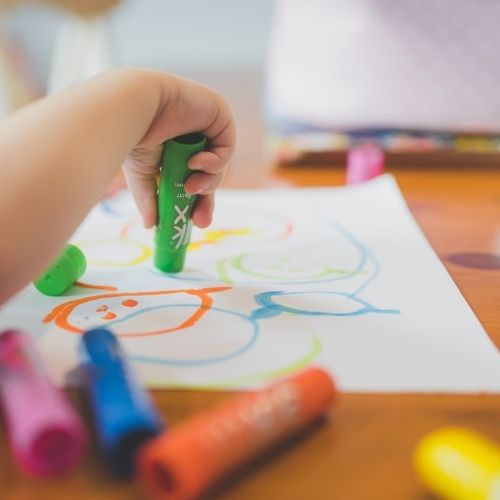 Mini Maltings child creating a picture